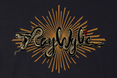 Graphic design featuring the name “Ray Wylie” in a stylized script where the first letter forms the head of a snake. A gold sunburst pattern radiates behind the text, and a small red figure appears perched on one of the letters.